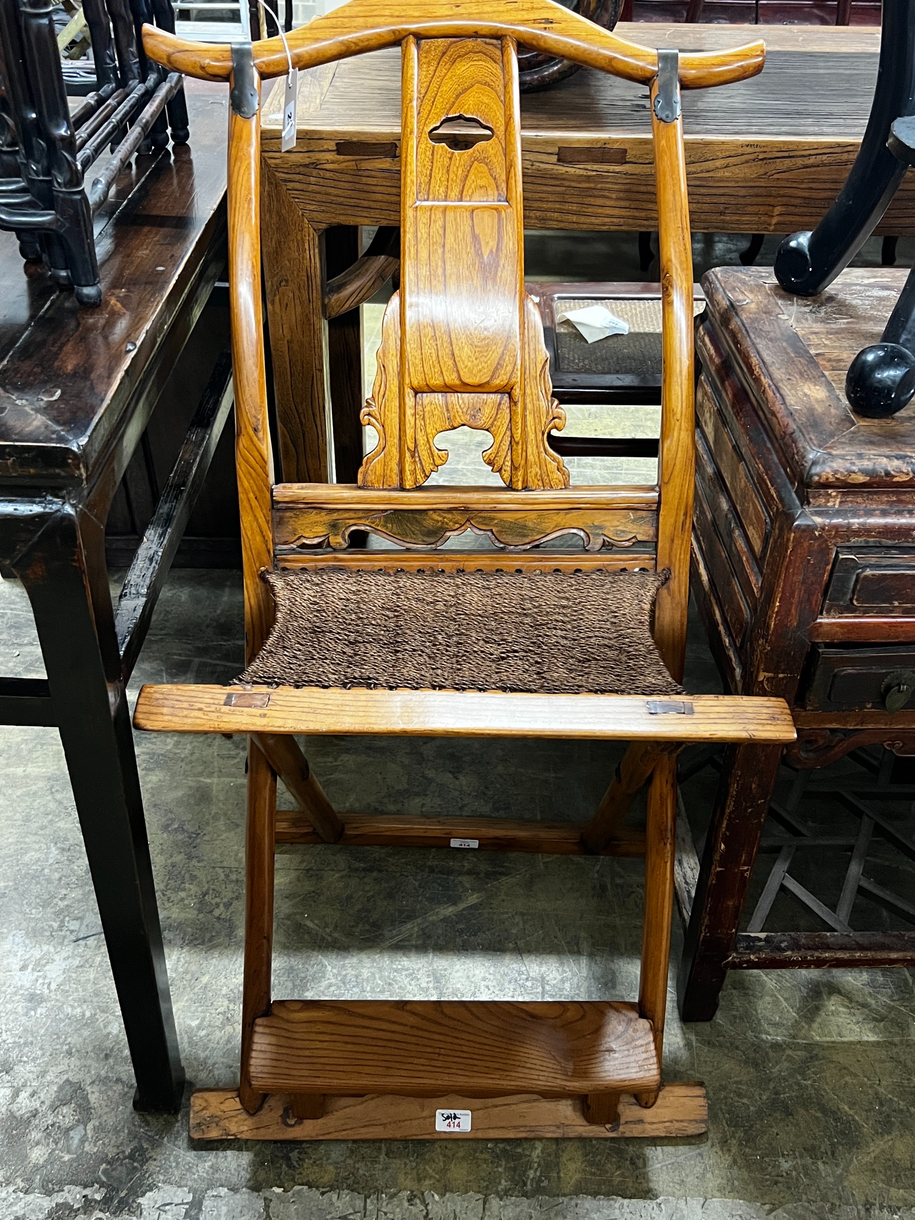 A Chinese elm folding hunting chair, height 105cm